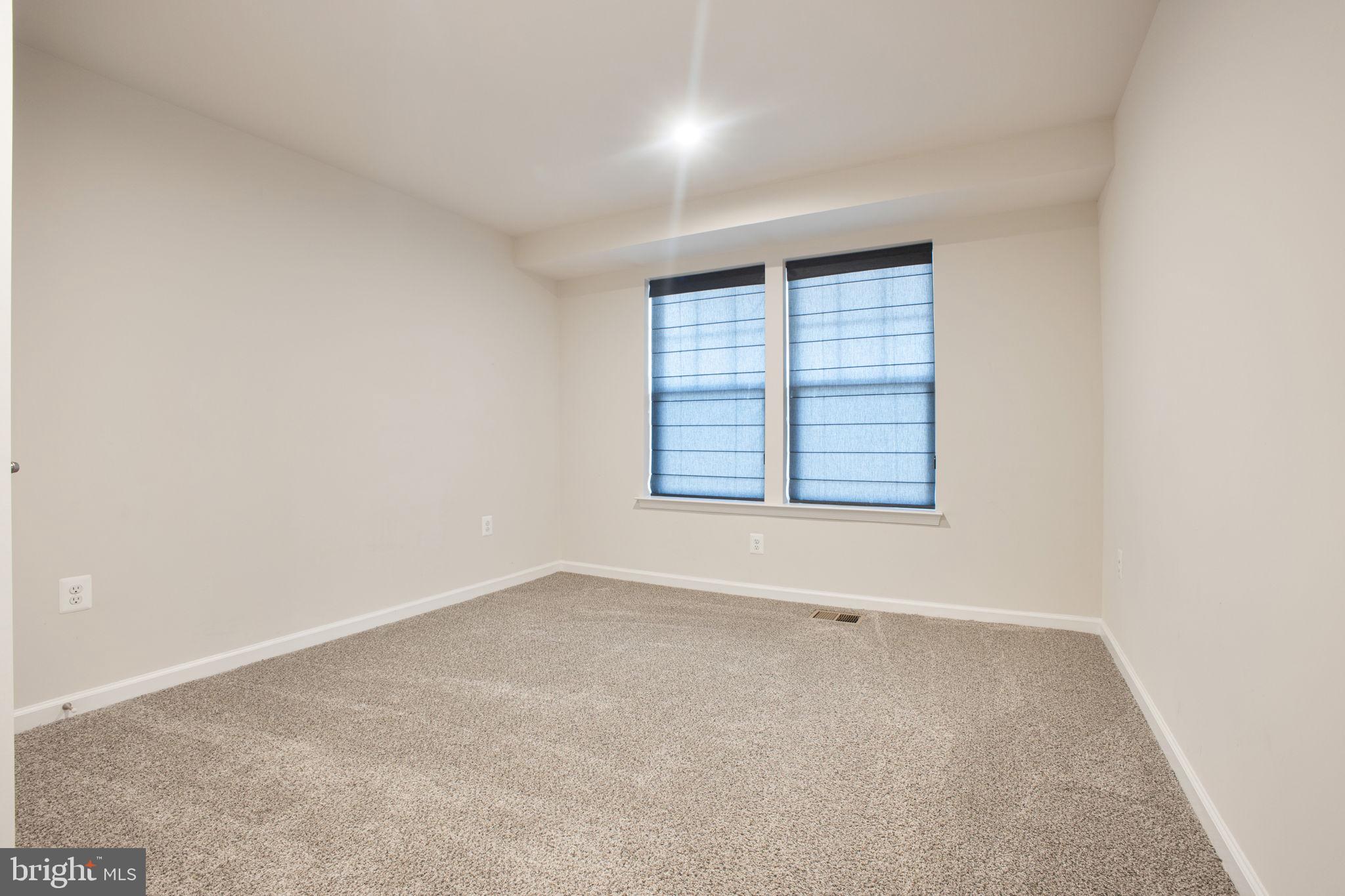 10517 Sally Ride Lane Lanham, MD 20706 - Photo 25 of 37 an empty room with windows