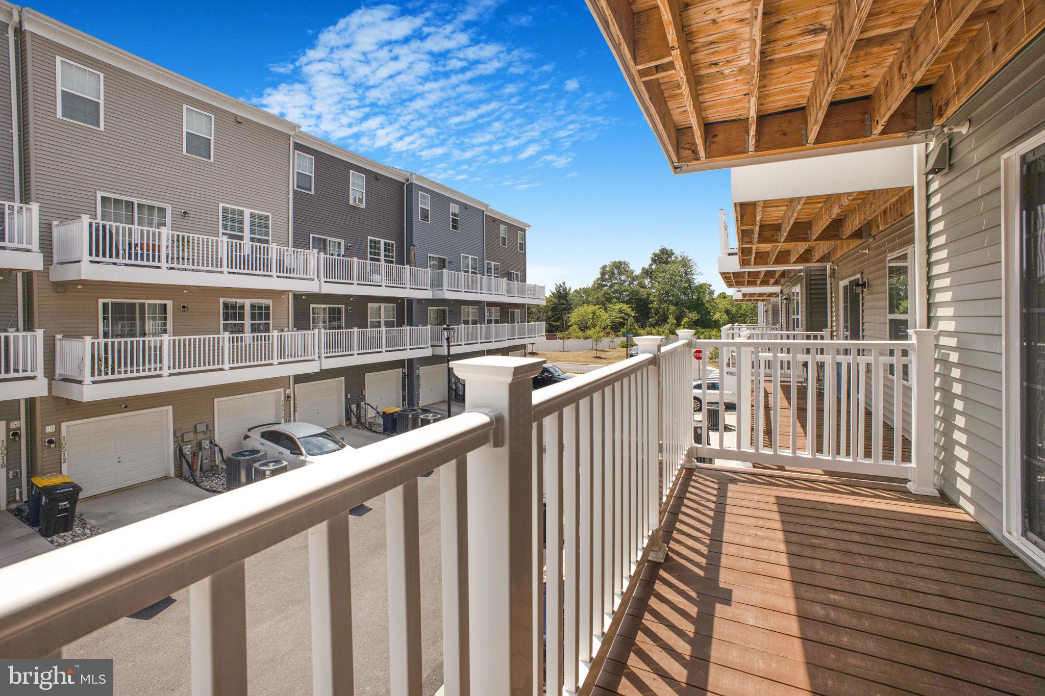 10517 Sally Ride Lane Lanham, MD 20706 - Photo 27 of 37 a balcony view with wooden floor and fence