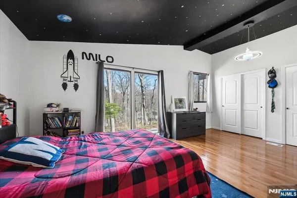 a house view with a sitting space fire pit and outdoor space