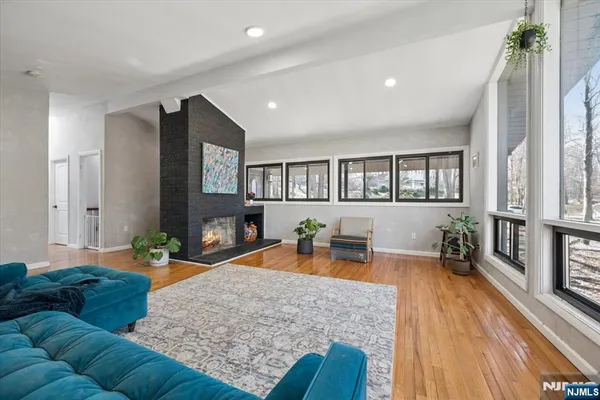 a kitchen with stainless steel appliances kitchen island granite countertop a refrigerator and a sink