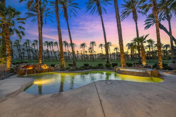 a view of swimming pool with trees