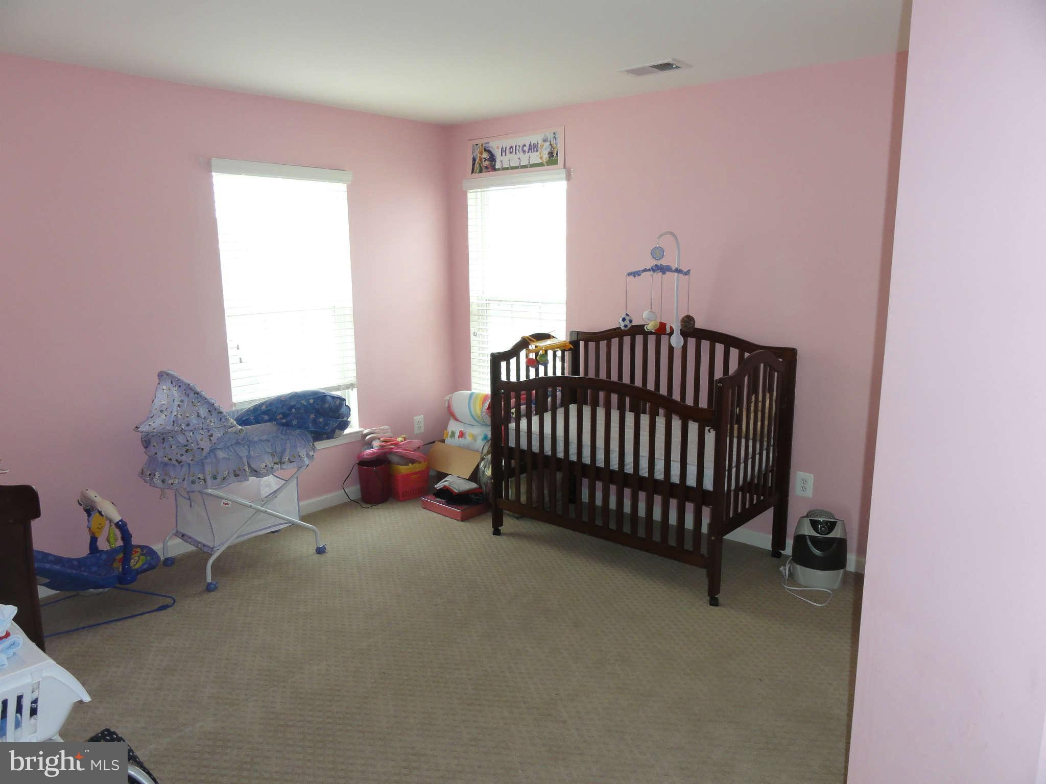 1341 Stallion Street Ranson, WV 25438 - Photo 14 of 27 a bed room with a bed and a window