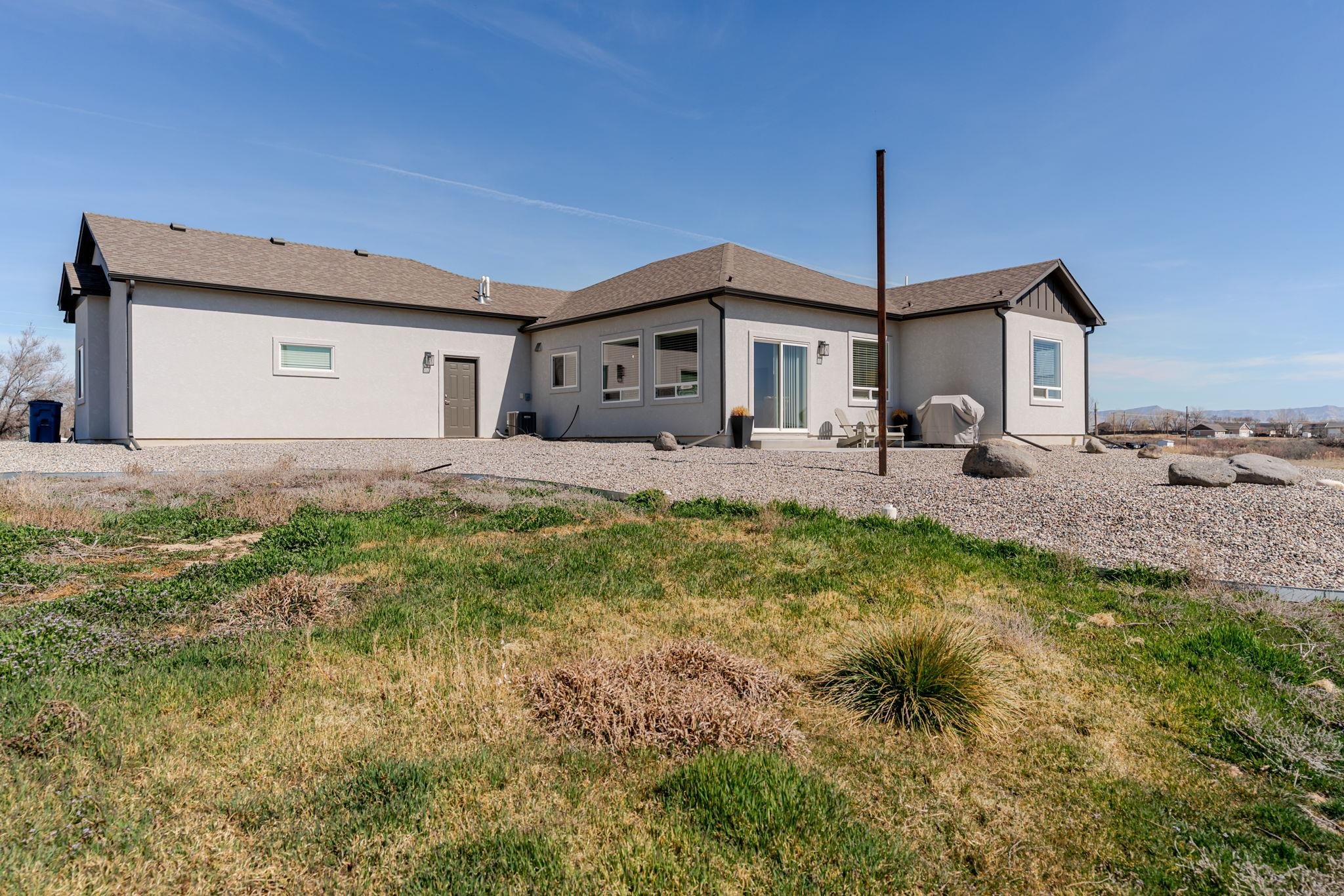 1301 M Road Loma, CO 81524 - Photo 8 of 32 a front view of a house with garden