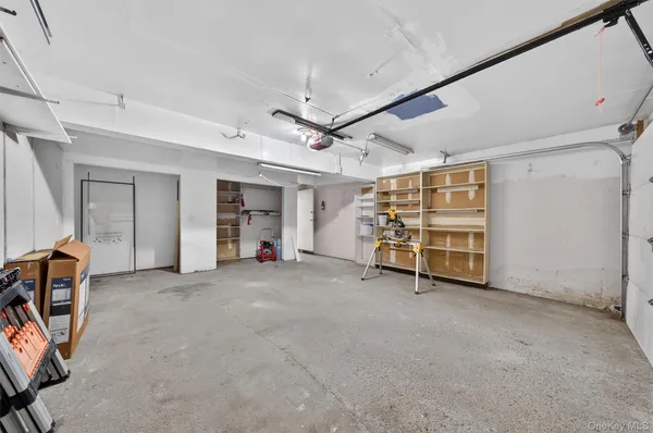 a view of an empty room with ceiling fan