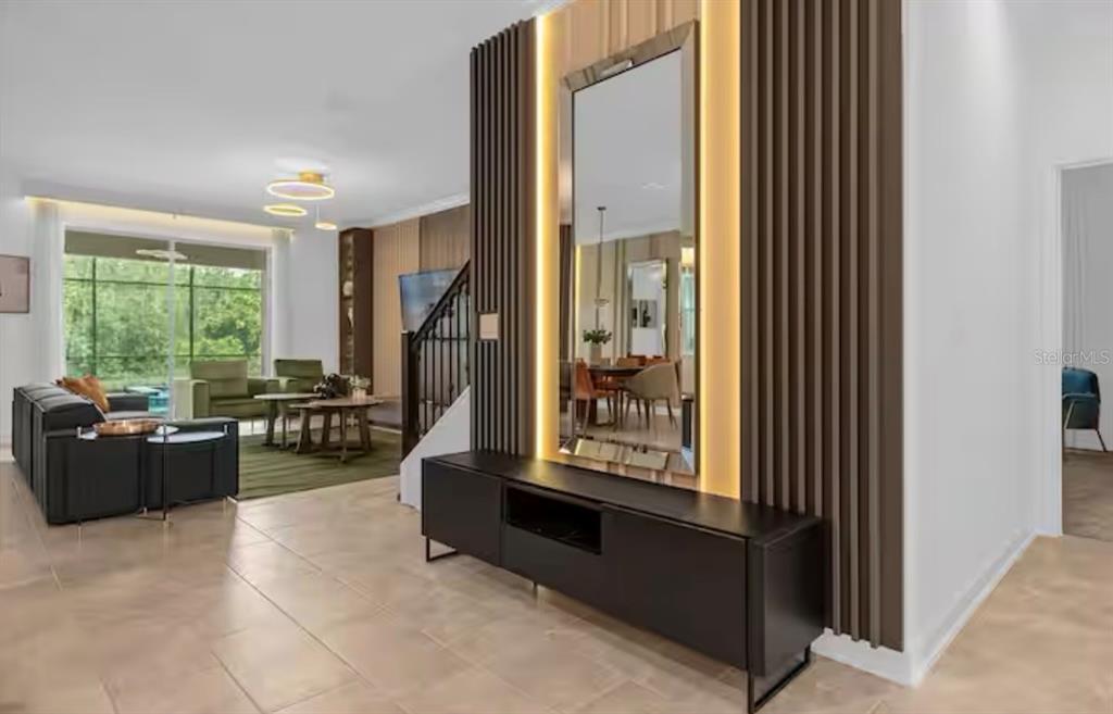 2992 Penelope Loop Kissimmee, FL 34746 - Photo 11 of 83 a living room with furniture and a window