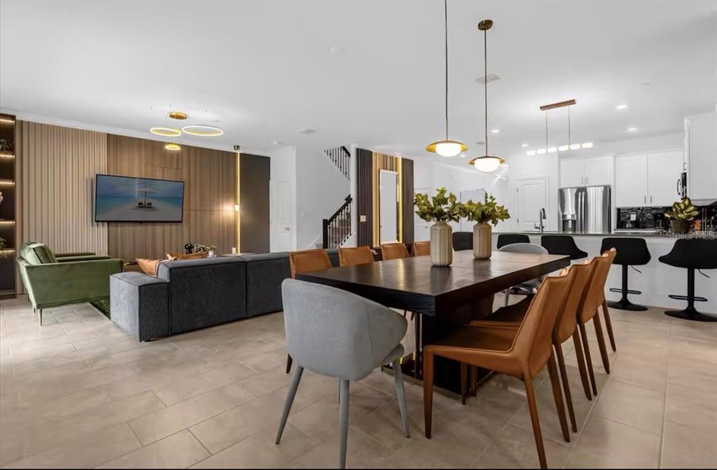 2992 Penelope Loop Kissimmee, FL 34746 - Photo 16 of 83 a view of a dining room with furniture