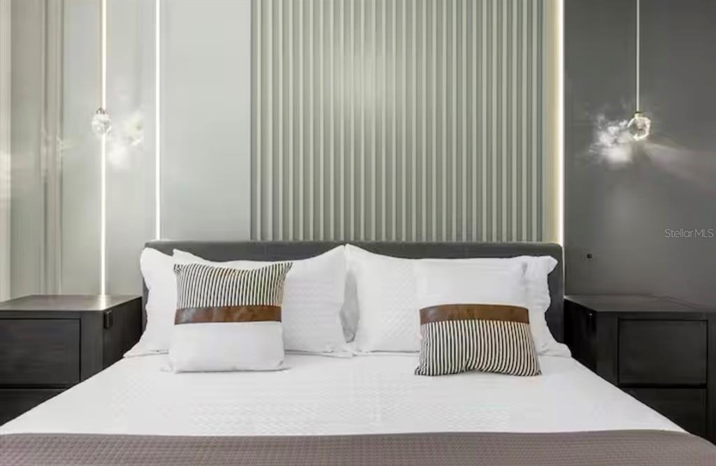 2992 Penelope Loop Kissimmee, FL 34746 - Photo 20 of 83 a bedroom with a bed and a night stand