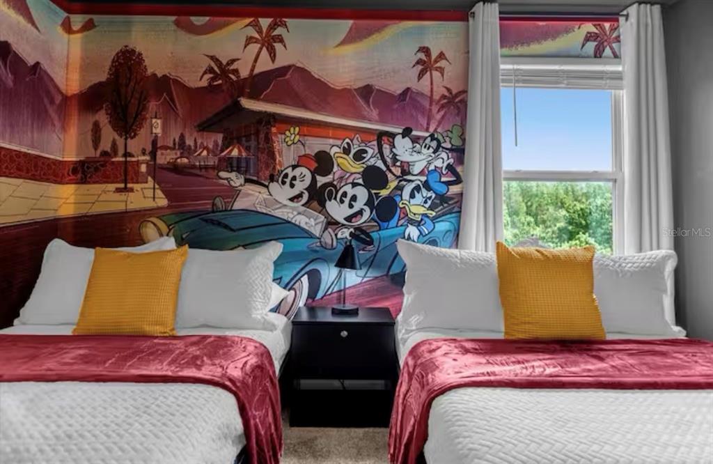 2992 Penelope Loop Kissimmee, FL 34746 - Photo 35 of 83 a bed sitting in a bedroom next to a window