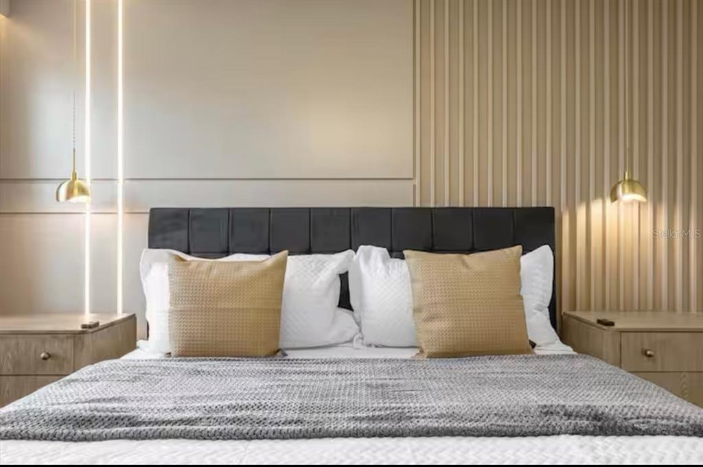 2992 Penelope Loop Kissimmee, FL 34746 - Photo 38 of 83 a large white bed in a white room