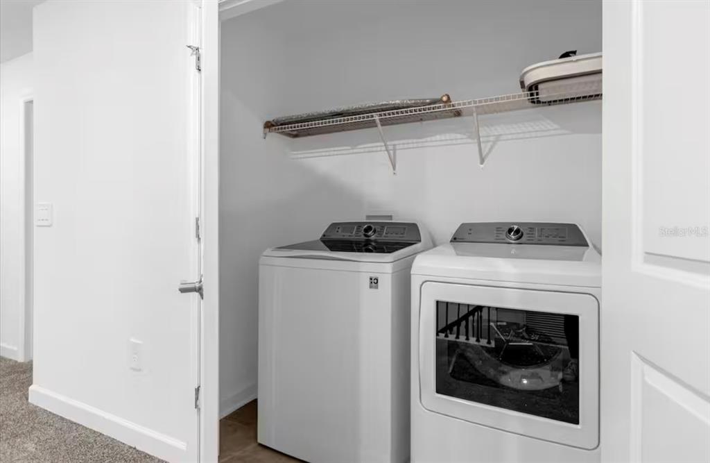 2992 Penelope Loop Kissimmee, FL 34746 - Photo 57 of 83 a utility room with dryer and washer