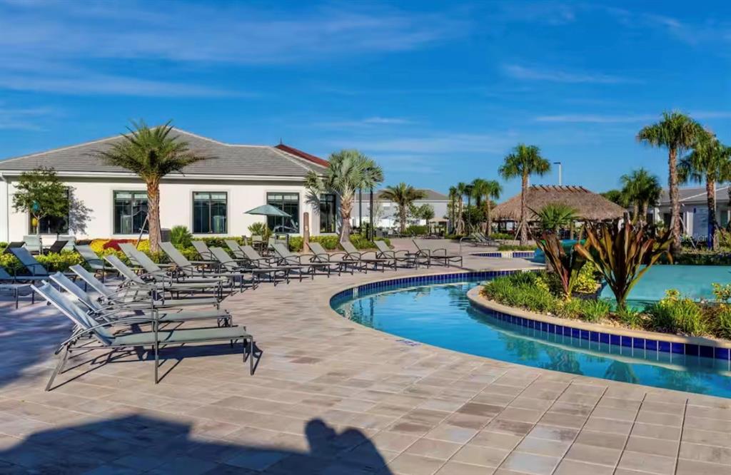 2992 Penelope Loop Kissimmee, FL 34746 - Photo 74 of 83 a view of a house with swimming pool and sitting area