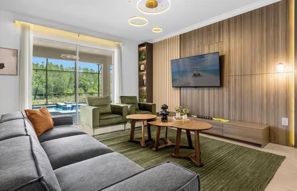 2992 Penelope Loop Kissimmee, FL 34746 - Photo 8 of 83 a living room with furniture and a window