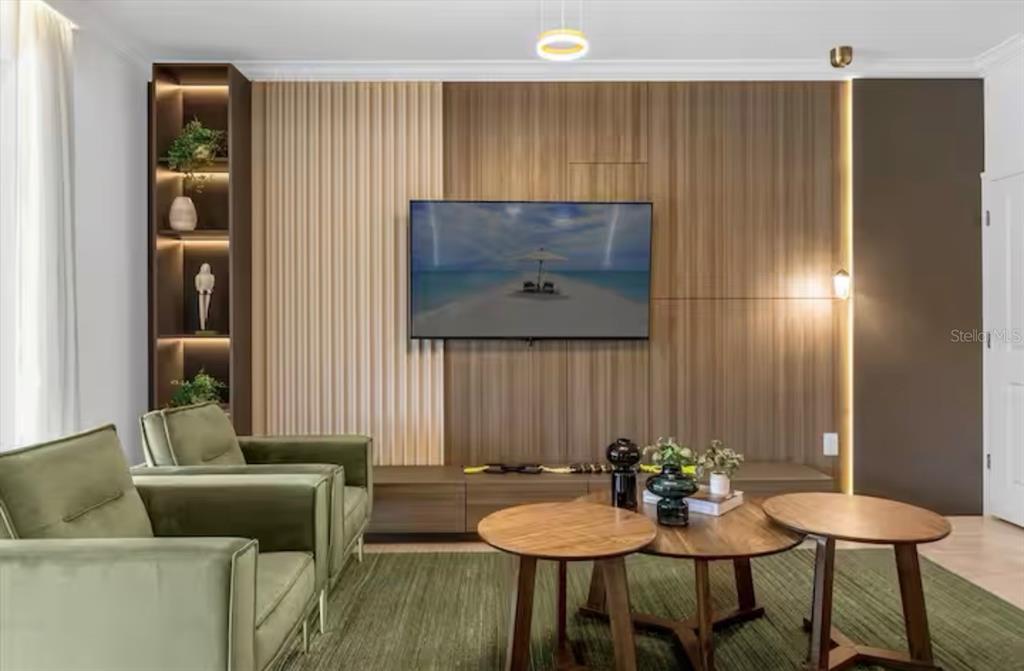 2992 Penelope Loop Kissimmee, FL 34746 - Photo 9 of 83 a living room with furniture and a painting on the wall