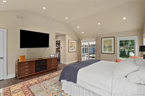 a bathroom with a bathtub shower sink and mirror