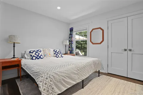 a bathroom with a granite countertop sink toilet and a mirror