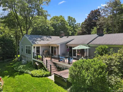 a view of a backyard with large trees