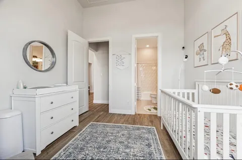 a view of a hallway to a livingroom and a wooden floor