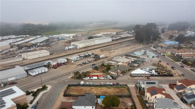 an aerial view of residential building and ocean view