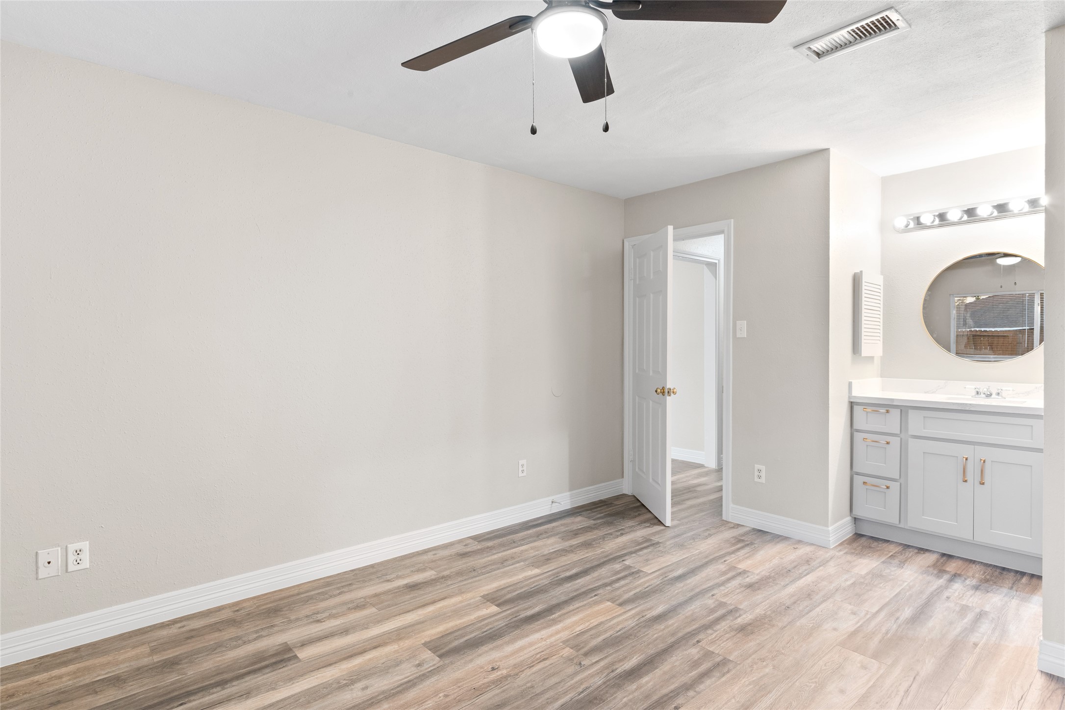 8314 Poplar Ridge Lane Humble, TX 77338 - Photo 16 of 20 wooden floor in an empty room with a window
