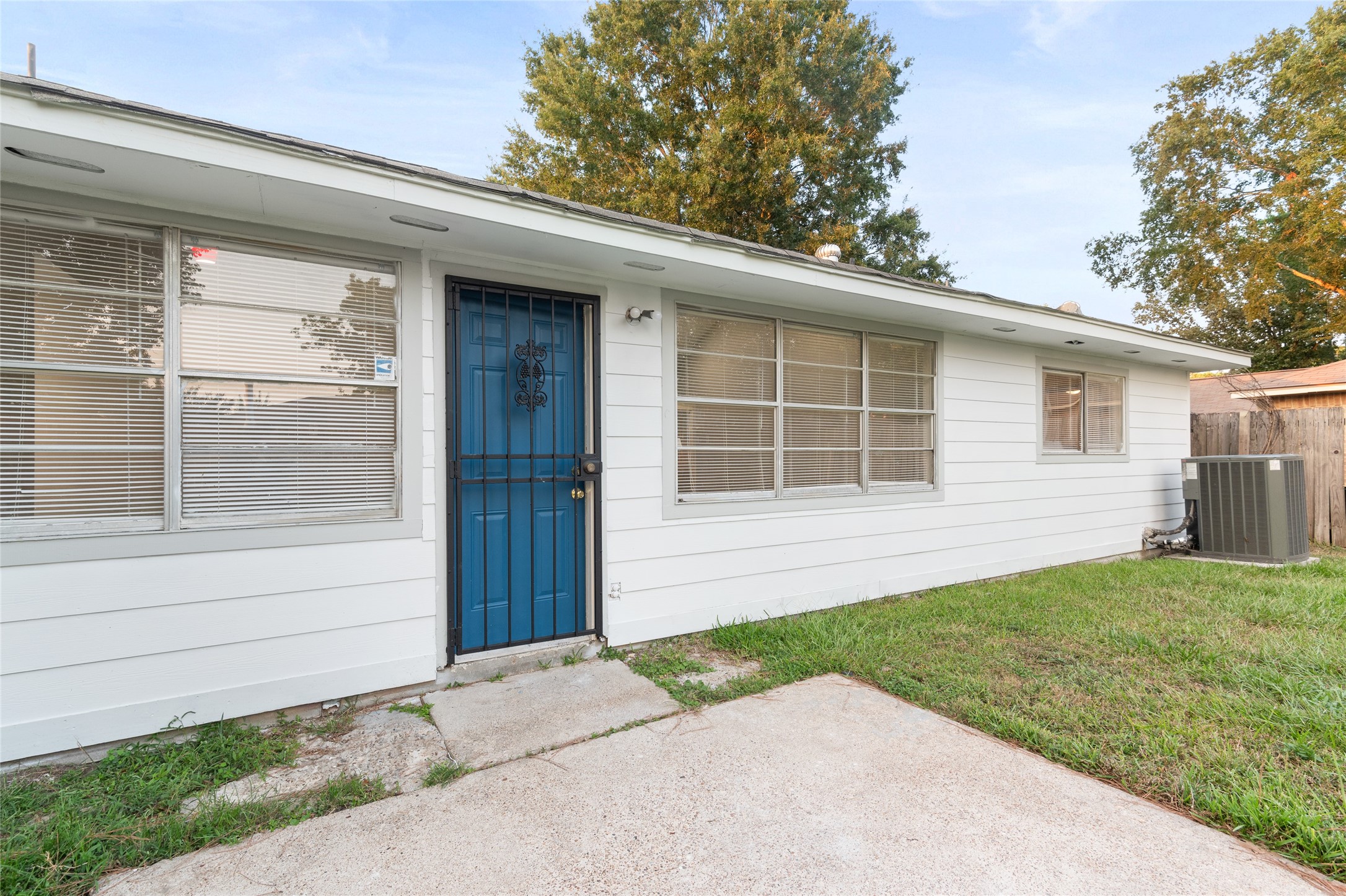 8314 Poplar Ridge Lane Humble, TX 77338 - Photo 19 of 20 a front view of a house with a yard and garage