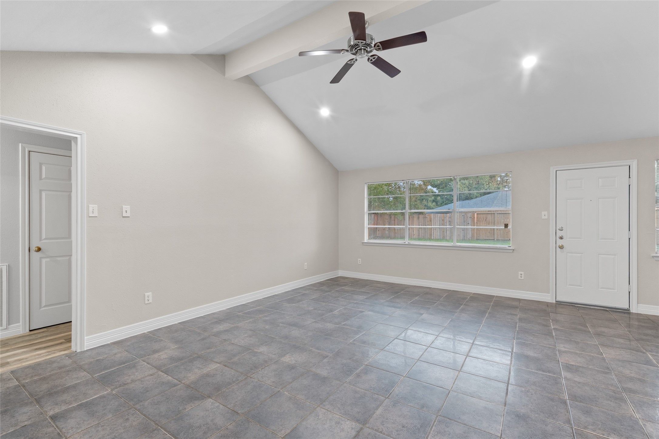 8314 Poplar Ridge Lane Humble, TX 77338 - Photo 7 of 20 a view of an empty room with a window