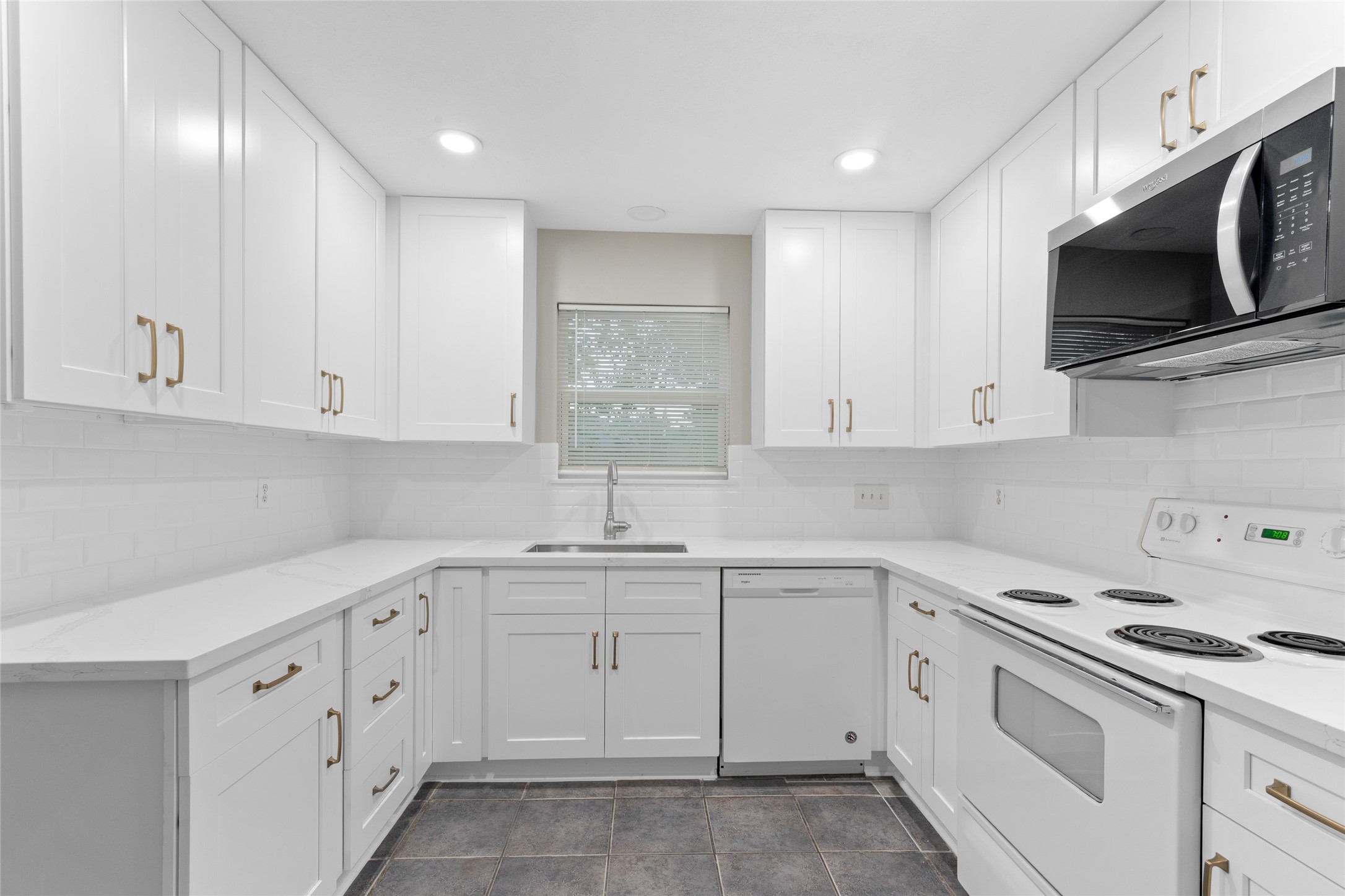 8314 Poplar Ridge Lane Humble, TX 77338 - Photo 10 of 20 a kitchen with white cabinets stainless steel appliances and sink