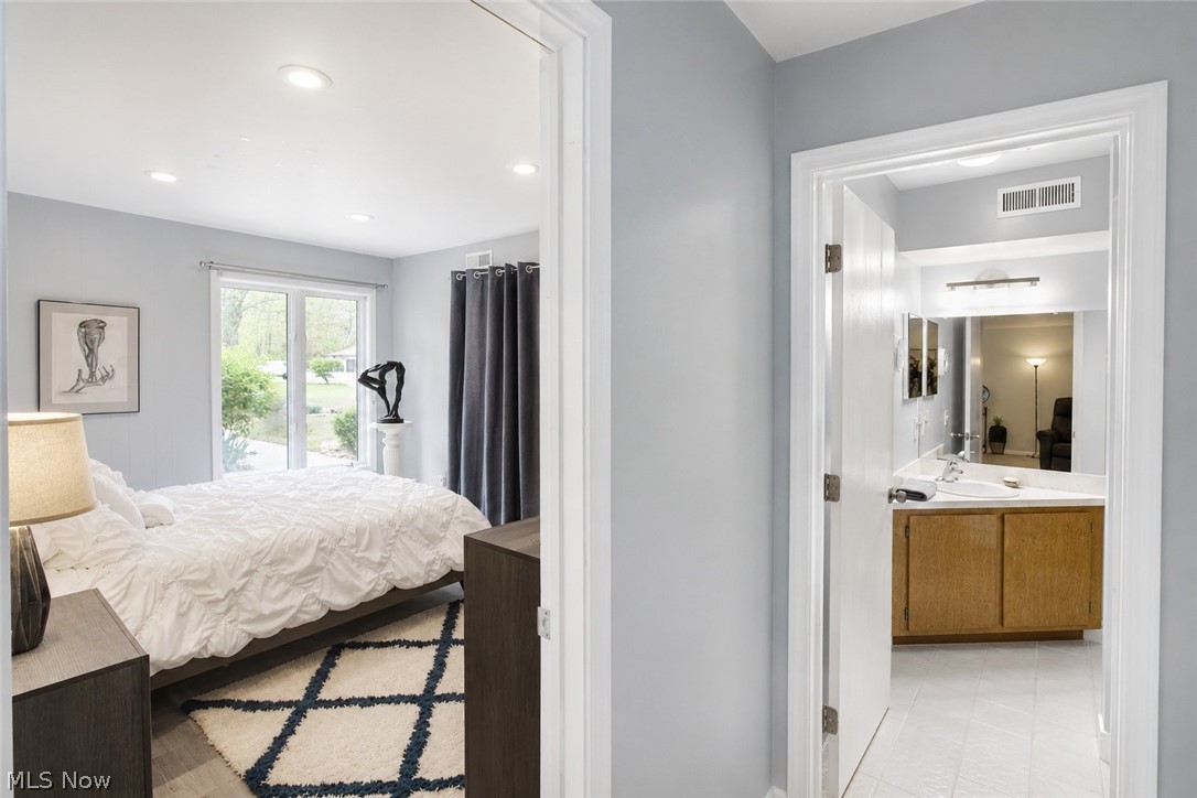 16575 Wren Road, Unit 3C Chagrin Falls, OH 44023 - Photo 16 of 29 Easy access from 2nd Bedroom is an updated full bath with replaced mirrors, medicine cabinet and light fixtures