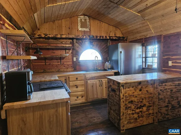 a kitchen with cabinets and window