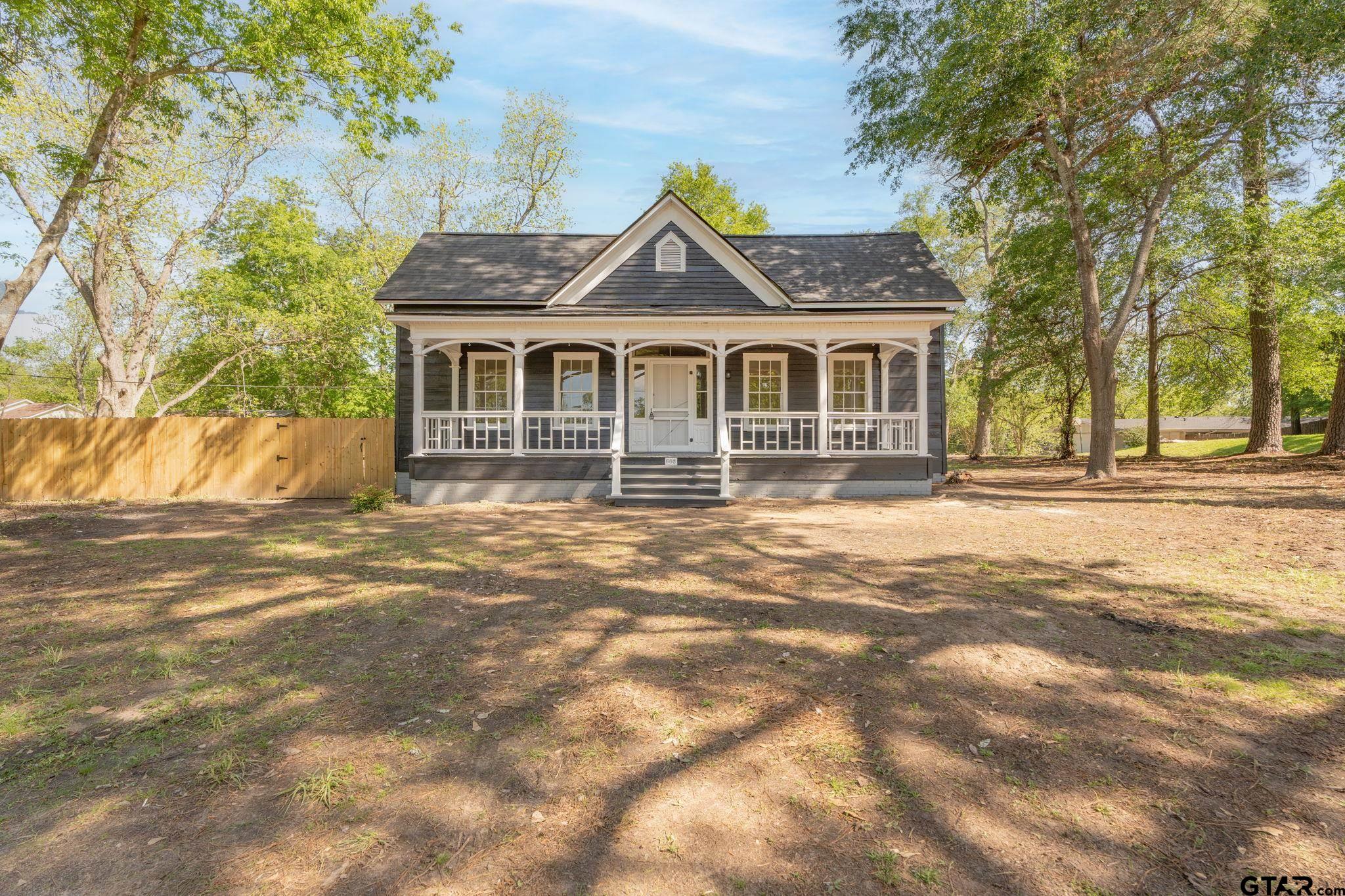 605 East Calvert Street Troup, TX 75789 - Photo 1 of 23 a front view of a house with a yard