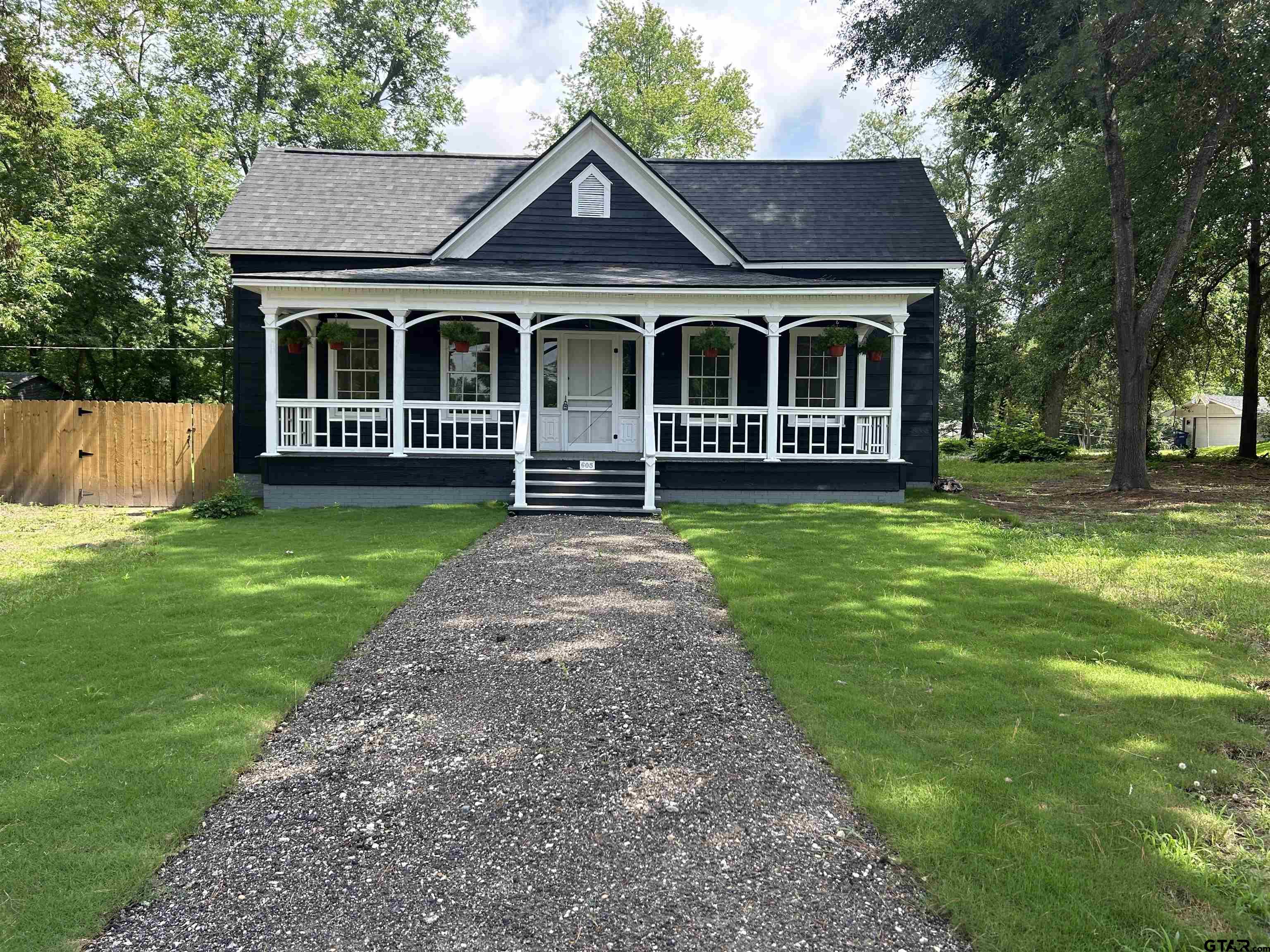 605 East Calvert Street Troup, TX 75789 - Photo 2 of 23 a view of a house with garden