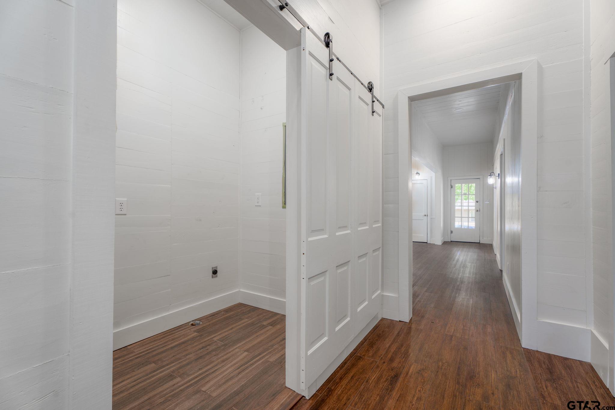 605 East Calvert Street Troup, TX 75789 - Photo 21 of 23 a view of a hallway with wooden floor