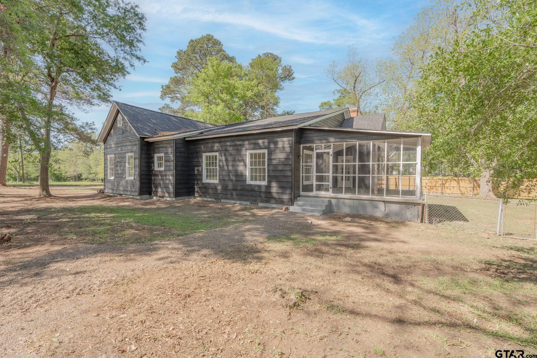 605 East Calvert Street Troup, TX 75789 - Photo 5 of 23 a view of a house with a yard