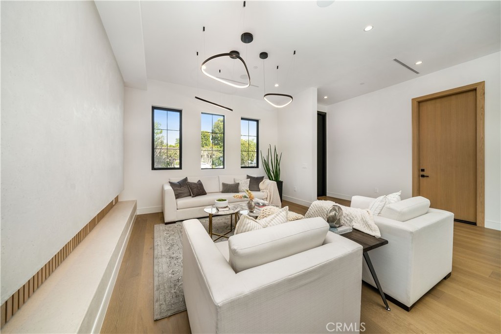 4919 Mammoth Avenue Sherman Oaks, CA 91423 - Photo 11 of 29 a living room with furniture and a large window
