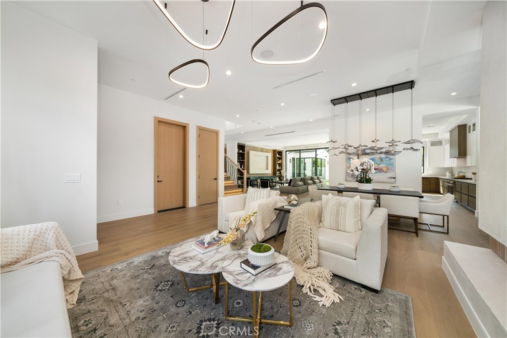 4919 Mammoth Avenue Sherman Oaks, CA 91423 - Photo 12 of 29 a living room with furniture or chandelier and a wooden floor