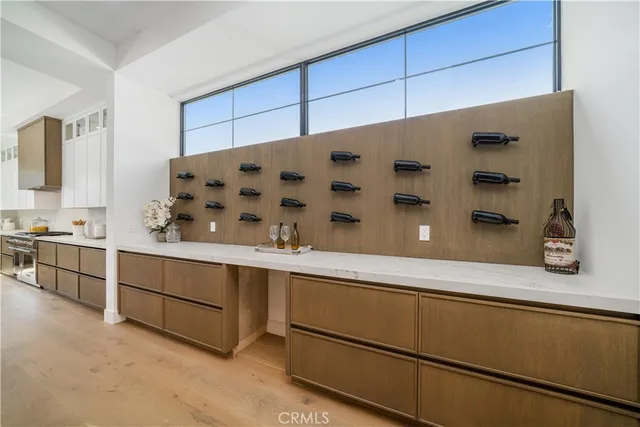a kitchen with cabinets and window