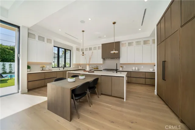 a kitchen with a sink a counter top space and appliances