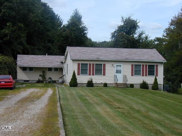 a view of a yard in front of a house