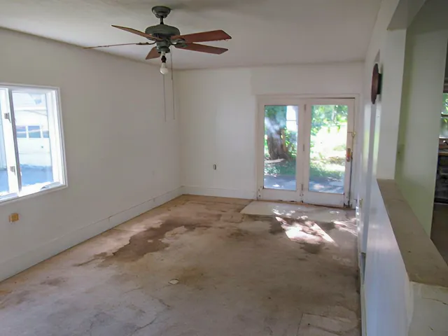 a view of an empty room with a window