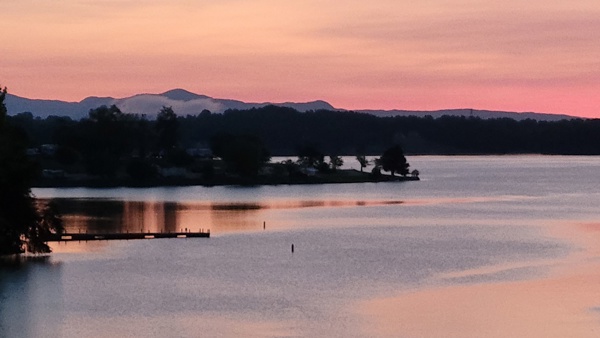 516 Hillandale Road Seneca, SC 29672 - Photo 42 of 50 The tranquil waterfront setting offers serene lake views and distant mountains.
