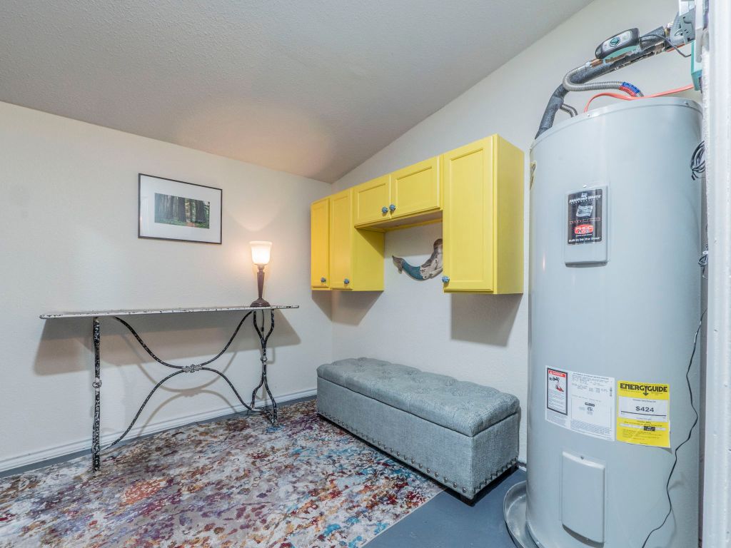 11012 3rd Street Jonestown, TX 78645 - Photo 19 of 26 a living room with couch and a table