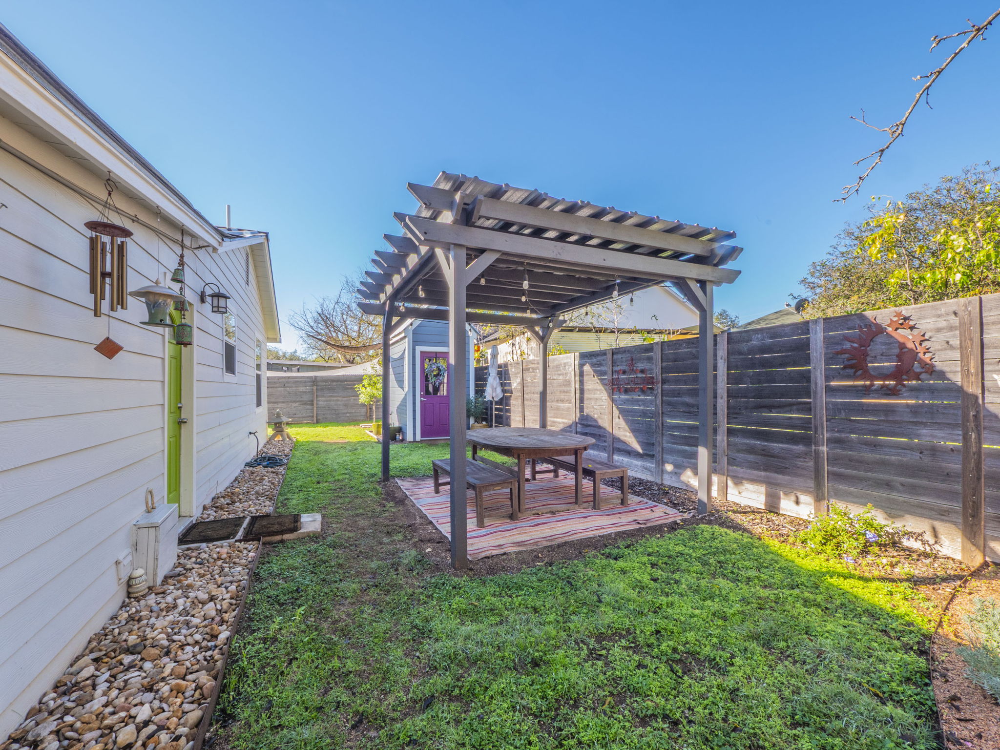 11012 3rd Street Jonestown, TX 78645 - Photo 21 of 26 Relax on the backyard deck under the shaded pergola.