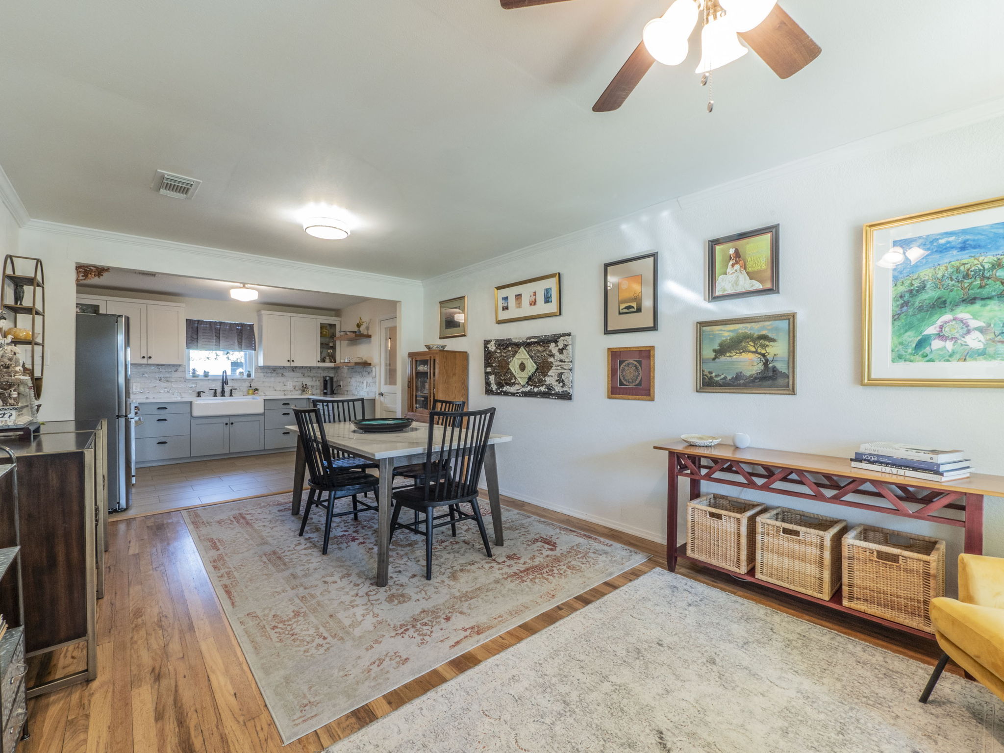 11012 3rd Street Jonestown, TX 78645 - Photo 25 of 26 Entrance of the home into the living room/dining area and kitchen. The living area features the original hardwood floors and an open-concept floor plan.