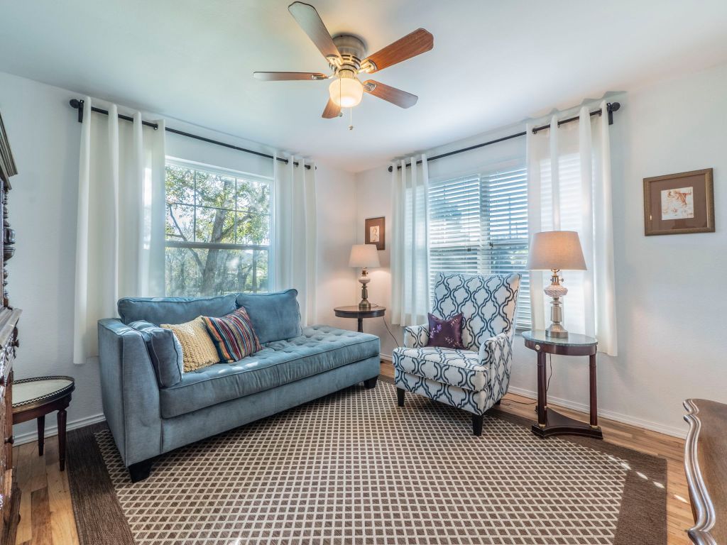 11012 3rd Street Jonestown, TX 78645 - Photo 9 of 26 a living room with furniture and a large window