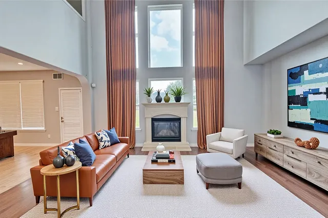 a living room with furniture and a fireplace