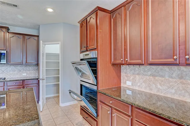 a view of a kitchen cabinets and a counter top space