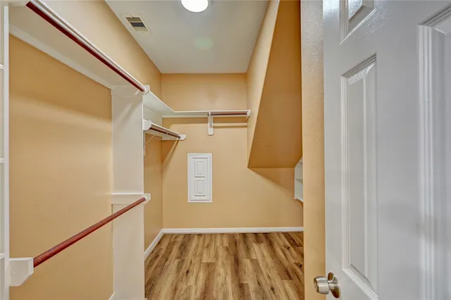 a view of bathroom with a tub and mirror