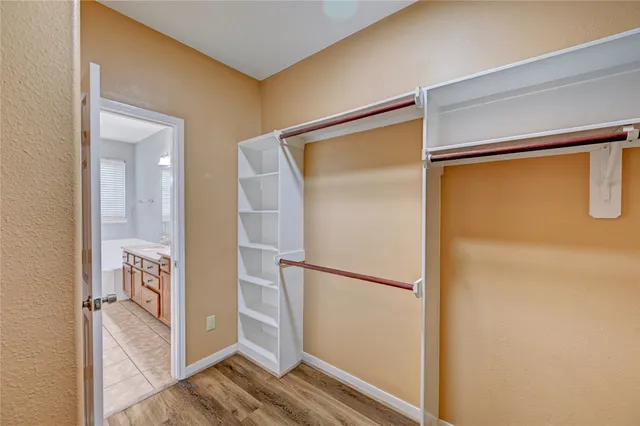 a bathroom with a sink a vanity and a mirror