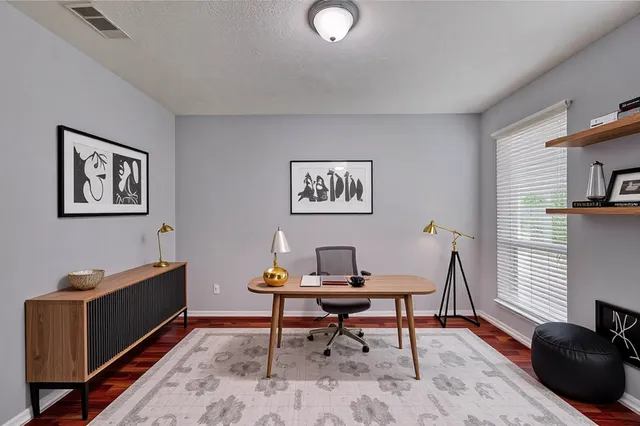 a workspace with furniture and window