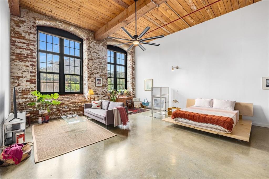 170 Boulevard Southeast, Unit 211H Atlanta, GA 30312 - Photo 1 of 49 a living room with furniture and a large window