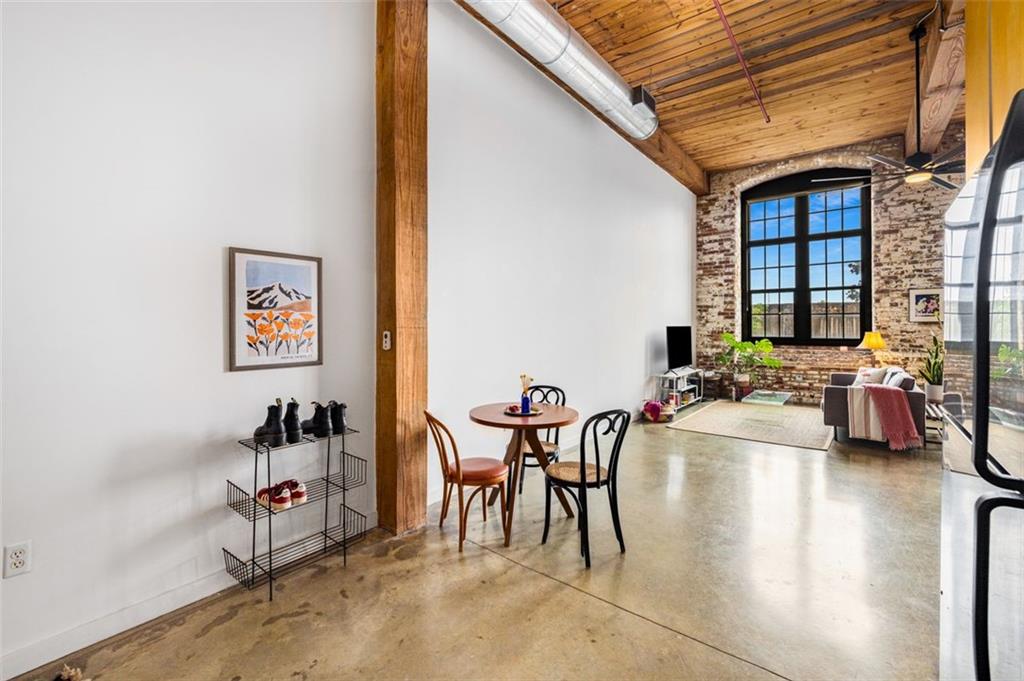 170 Boulevard Southeast, Unit 211H Atlanta, GA 30312 - Photo 11 of 49 a view of a dining room with furniture and a window